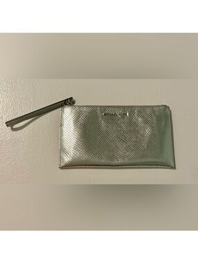 Michael Kors Jet Set Travel pochette or wristlet in a silver snake-embossed.
